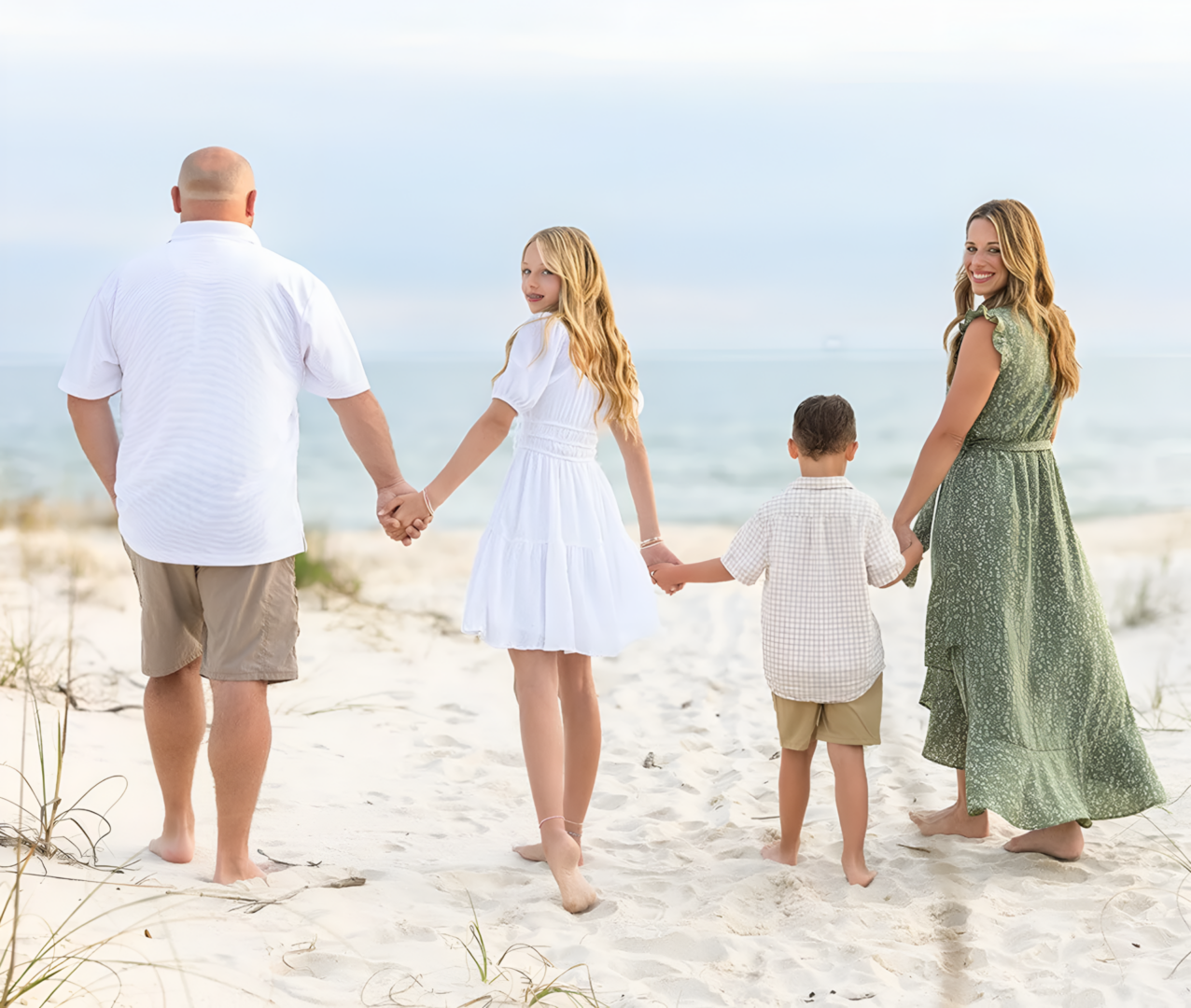 Family enjoying seaside walk together